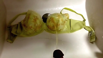 Pissing unaffected by wife's bra